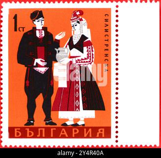 Photo of a 1 Bulgarian stotinka postage stamp Man and Woman from Silistra from the 1968 folk costumes series Stock Photo