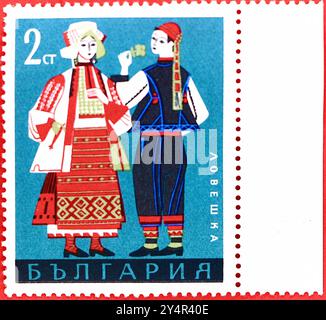 Photo of a 2 Bulgarian stotinka postage stamp Man and Woman from Lovech from the 1968 folk costumes series Stock Photo