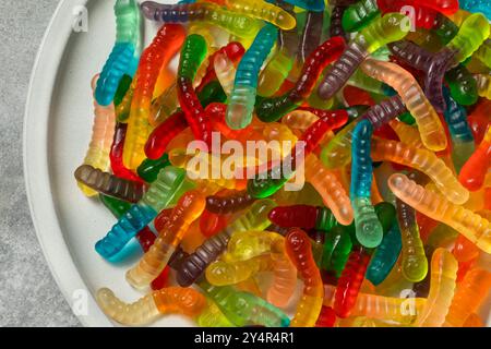 Sweet Sugary Gummy Worms for Halloween in a Bowl Stock Photo