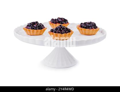 Small cakes with currant on white big plate Stock Photo