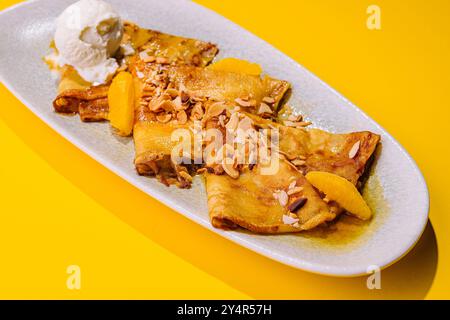 pancakes in honey syrup with mendal and ice cream Stock Photo