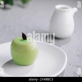 apple shaped mousse cake and tea Stock Photo