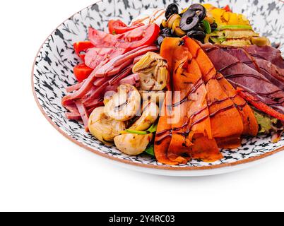salad of various meats with mushrooms, carrots and lettuce leaves Stock Photo