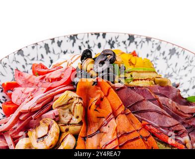 salad of various meats with mushrooms, carrots and lettuce leaves Stock Photo