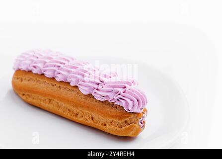 Fresh tasty eclairs isoalted on white background Stock Photo