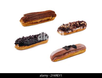 Eclairs with Chocolate Cream and Hazelnuts on White background Stock Photo