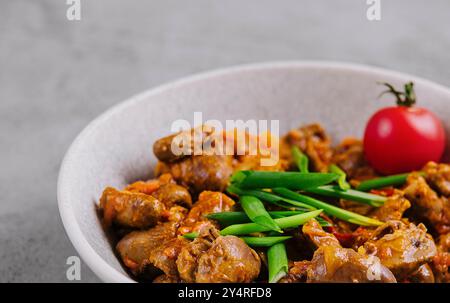 liver and hearts in sauce and onions Stock Photo