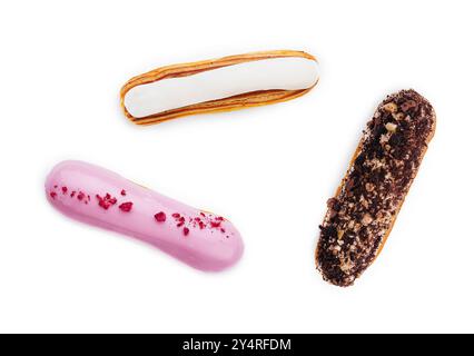 three different types of French eclairs on a white plate isolated on white background Stock Photo
