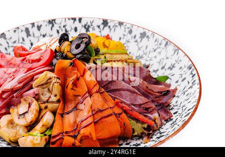 salad of various meats with mushrooms, carrots and lettuce leaves Stock Photo