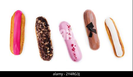 different types of French eclairs on a white plate isolated on white background Stock Photo