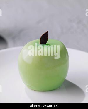 Green apple shaped mousse cake close up Stock Photo