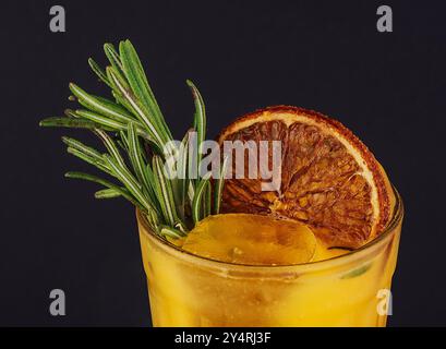 Cold season drink - orange and rosemary cocktail Stock Photo