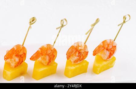 Canapes with shrimp and pineapple on plate Stock Photo