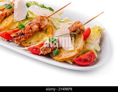 trendy Caesar salad with chicken on wooden skewers Stock Photo
