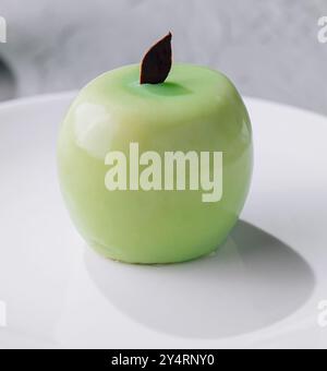apple shaped mousse cake on plate Stock Photo