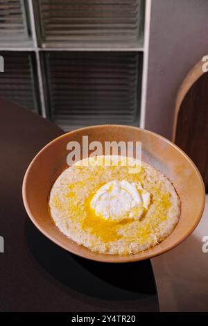 hot delicious creamy polenta with melted gorgonzola cheese on white ...
