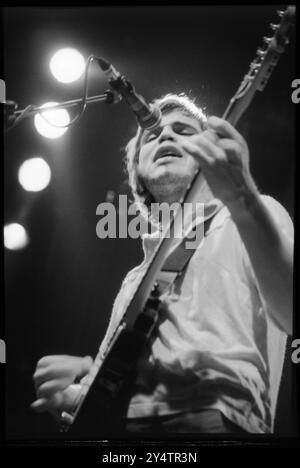 SUPERGRASS, CONCERT, 1997: Gas Coombes of Supergrass playing live at Newport Centre in Newport, Wales, UK with their second album on 10 May 1997. Photograph: Rob Watkins.   INFO: Supergrass, a British rock band, achieved success in the 1990s with their infectious blend of Britpop and punk influences. Hits like 'Alright' and albums such as 'I Should Coco' solidified their reputation for energetic, catchy tunes, contributing to the vibrant music scene of the era. Stock Photo