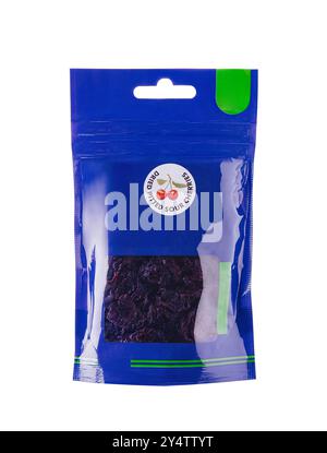 Blue doypack pouch filled with dried pitted sour cherries packaging mockup is standing up on a white background Stock Photo