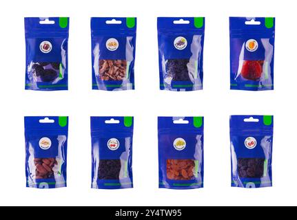 Eight blue packages containing various dried fruits and nuts are standing up against a white background Stock Photo