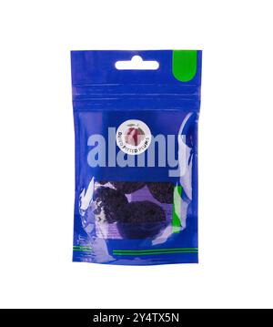 Sealed retail pack of dried pitted plums in a blue plastic bag, isolated on a white background Stock Photo