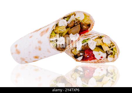 Two delicious vegetarian shawarma are lying horizontally on a white reflecting surface Stock Photo