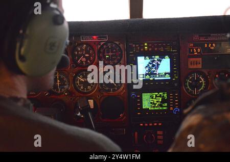 A pilot and passenger at the cockpit of a Cessna 210 light aircraft Stock Photo