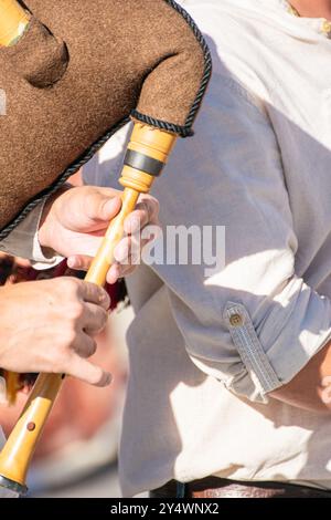 Hands of a musician playing a bagpipe typical instrument in Galicia, Spain. Folk music concept Stock Photo