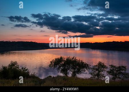 A Colorful sunset over Lake Minnewasta, Morden, Manitoba, Canada. Stock Photo