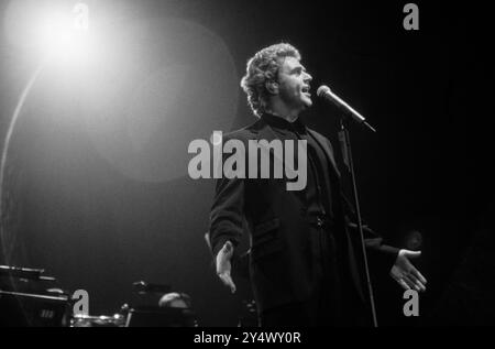 MICHAEL BALL, HOME CONCERT, 1996: Welsh singer Michael Ball at his youthful West End star peak playing a hometown gig with his 'The Musicals' album live at Cardiff International Arena CIA in Cardiff, Wales, UK on 6 December 1996. Photo: Rob Watkins. INFO: Michael Ball is a British singer, actor, and musical theatre star known for his powerful voice and versatile performances. With a career spanning decades, he has starred in major West End productions and released numerous albums, excelling in both pop and theatre. Stock Photo