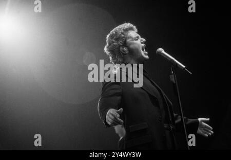 MICHAEL BALL, HOME CONCERT, 1996: Welsh singer Michael Ball at his youthful West End star peak playing a hometown gig with his 'The Musicals' album live at Cardiff International Arena CIA in Cardiff, Wales, UK on 6 December 1996. Photo: Rob Watkins. INFO: Michael Ball is a British singer, actor, and musical theatre star known for his powerful voice and versatile performances. With a career spanning decades, he has starred in major West End productions and released numerous albums, excelling in both pop and theatre. Stock Photo