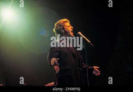 MICHAEL BALL, HOME CONCERT, 1996: Welsh singer Michael Ball at his youthful West End star peak playing a hometown gig with his 'The Musicals' album live at Cardiff International Arena CIA in Cardiff, Wales, UK on 6 December 1996. Photo: Rob Watkins. INFO: Michael Ball is a British singer, actor, and musical theatre star known for his powerful voice and versatile performances. With a career spanning decades, he has starred in major West End productions and released numerous albums, excelling in both pop and theatre. Stock Photo