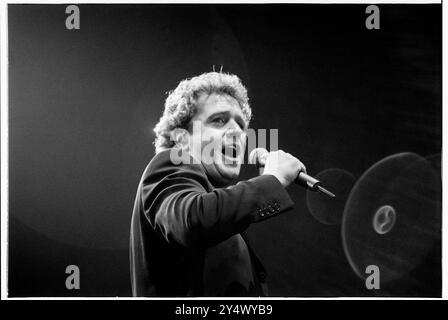 MICHAEL BALL, HOME CONCERT, 1996: Welsh singer Michael Ball at his youthful West End star peak playing a hometown gig with his 'The Musicals' album live at Cardiff International Arena CIA in Cardiff, Wales, UK on 6 December 1996. Photo: Rob Watkins. INFO: Michael Ball is a British singer, actor, and musical theatre star known for his powerful voice and versatile performances. With a career spanning decades, he has starred in major West End productions and released numerous albums, excelling in both pop and theatre. Stock Photo