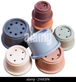 Childrens toy plastic cup pyramid made of multicolored elements Stock Photo