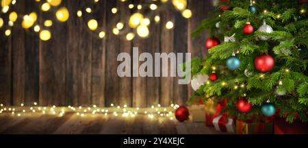 Festive elegant Christmas scene with the closeup of a nicely decorated fir tree and blue illuminated background with vignetting and copy space Stock Photo