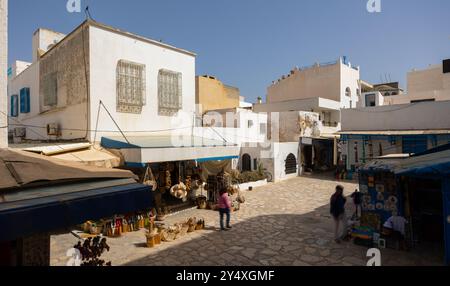 Street in Medina in Sousse, Tunisia. Medieval town Hammamet with colorful walls and house with small private oriental souvenir shops Stock Photo