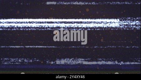 Glitch effect image with static noise and horizontal lines over dark background Stock Photo