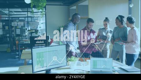 Business data analytics image over diverse team collaborating in modern office Stock Photo