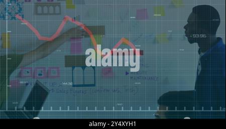 Declining stock market graph image over business meeting with charts and sticky notes Stock Photo