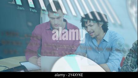 Business data graph image over two men working on laptop in office Stock Photo