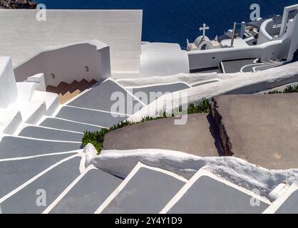 Abstract of whitewashed walls, steps,  cross, and angles in Santorini, Fira, Greece. Stock Photo