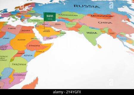 A map of the Middle East with a Saudi Arabia flag on it. The flag with green in color. Travel and government concept Stock Photo