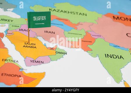A map of the Middle East with a Saudi Arabia flag on it. The flag with green in color. Travel and government concept Stock Photo