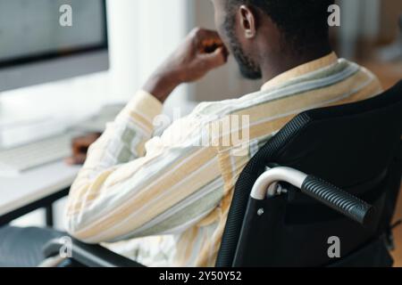 Man With Disability Working On Computer Stock Photo