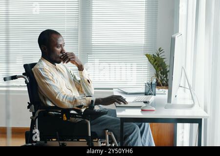 Businessman Working On Computer In Office Stock Photo