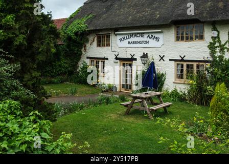 The Tollemache Arms, a pretty thatched village pub in Harrington, Northamptonshire, UK; named as Great British Pub of the Year 2024 Stock Photo