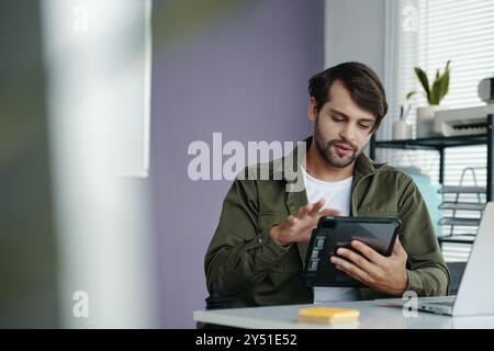 Manager Working Online On Tablet PC Stock Photo