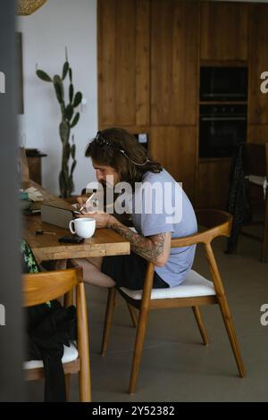Man using tablet computer while working in office. Stock Photo
