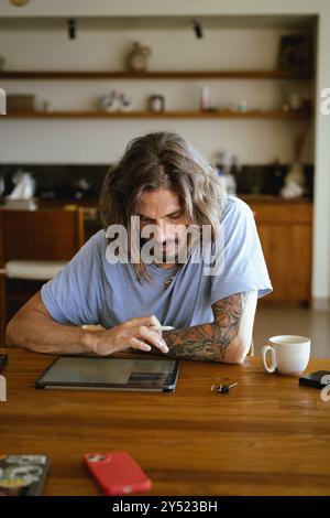 Man using tablet computer for work. Stock Photo
