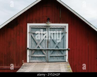 traditional Swedish barn doors at a summer house in the high coast Stock Photo