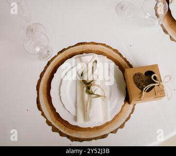 Rustic table setting with wood slice charger Stock Photo